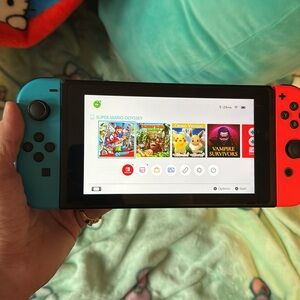 Nintendo switch handheld gaming system like brand new barley ever used
